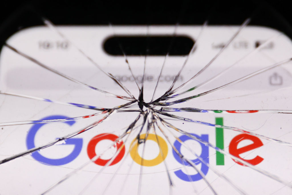 Google logo on website displayed on a phone screen is seen through the broken glass in this illustration photo taken in Krakow, Poland on April 25, 2024. (Photo by Jakub Porzycki/NurPhoto via Getty Images)